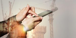 Double exposure of woman hand touch screen smartphone, mobile, construction crane, building and sunset in the evening as business, technology, telecommunication and industry concept